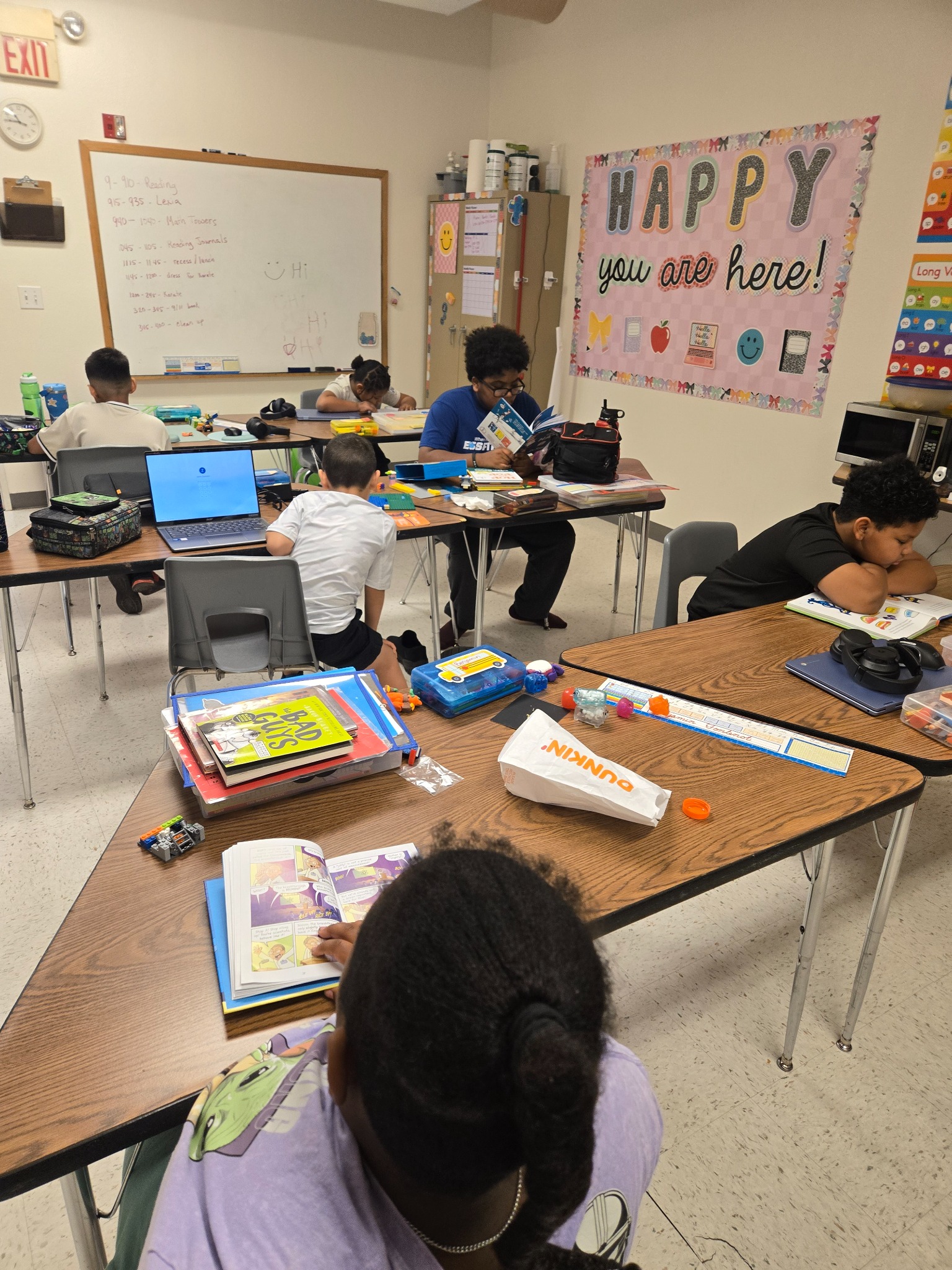 Heart Filled Academy students reading independently during classroom silent reading time